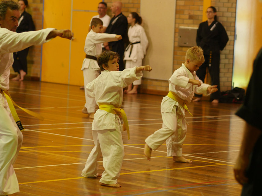 Yellow belts practicing patterns at grading
