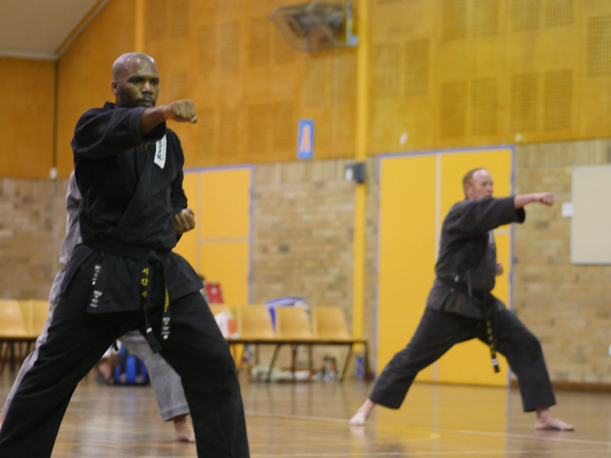 Senior black belt martial artist practicing patterns