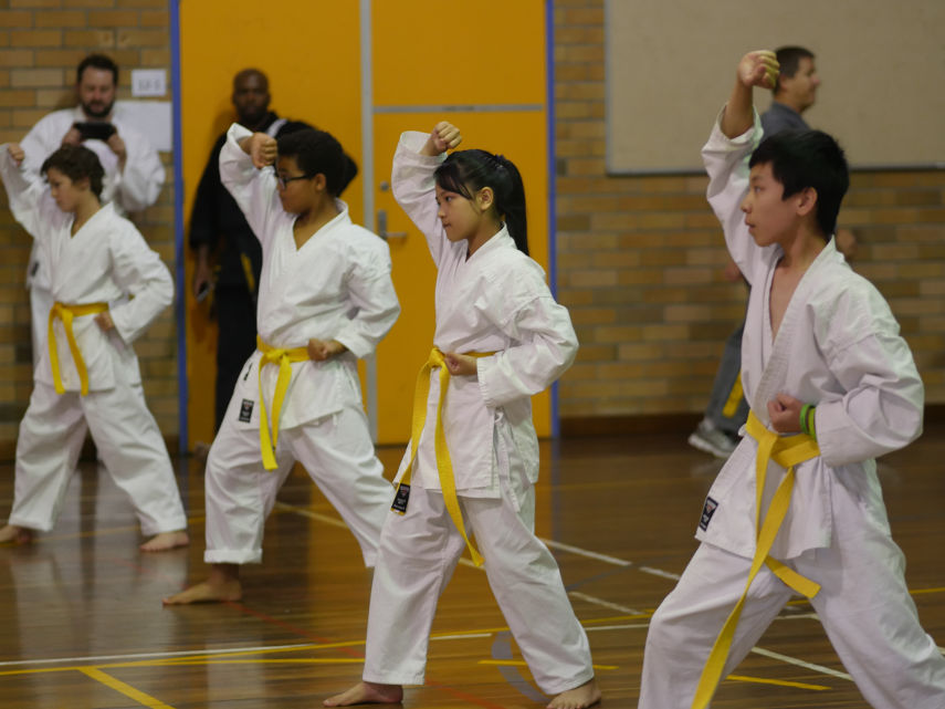 Yellow belts practicing their patterns